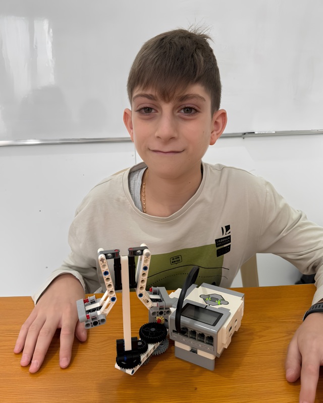 RoboStars student with a custom multi-motor robotics build